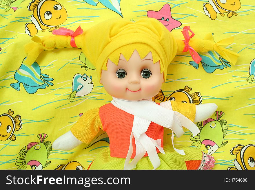 Yellow doll on a bright background. Yellow doll on a bright background