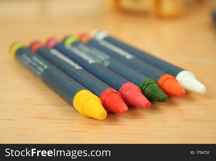 The colored pencils on the table