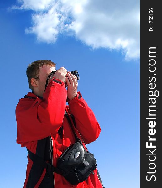 Young photographer taking photo from beautiful nature