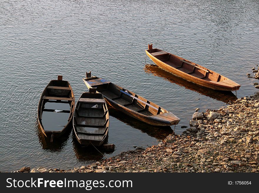 River boats anchor on the beach