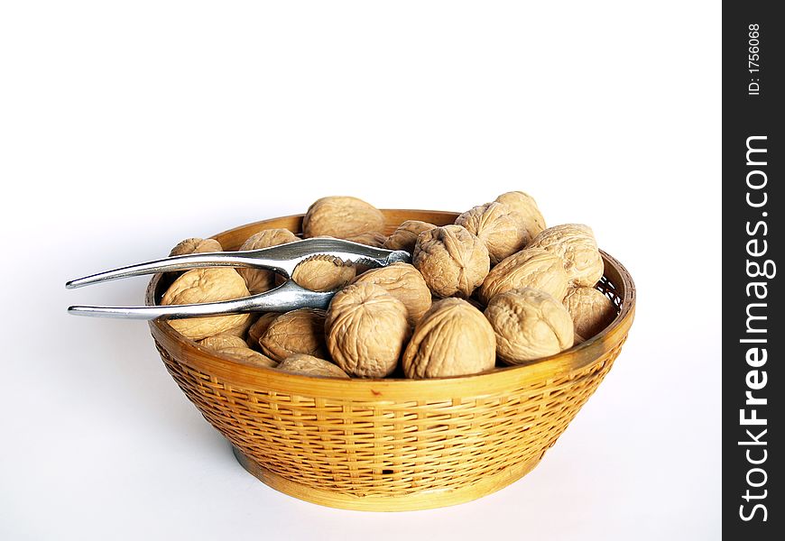 Walnuts in a bowl over white