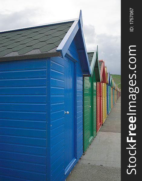 Primary coloured beach huts Whitby North Yorkshire