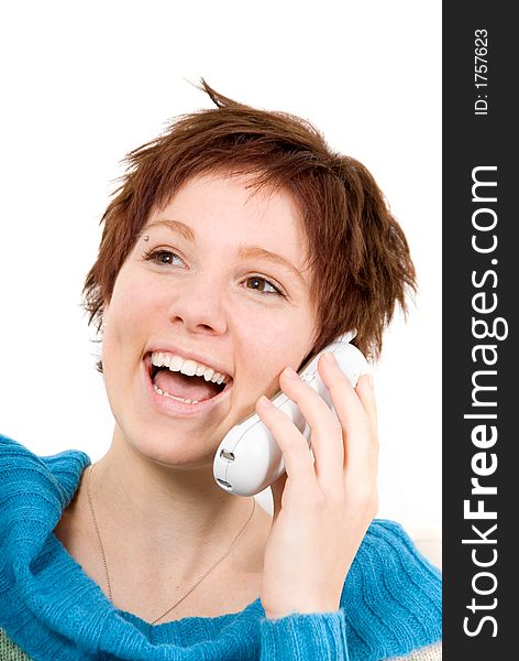 Cute woman on the wireless phone laughing. Cute woman on the wireless phone laughing