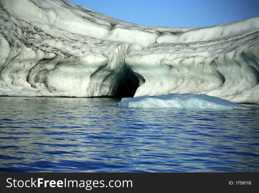 Iceberg with layers of lava through it Jokulsarlon lagoon Iceland. Iceberg with layers of lava through it Jokulsarlon lagoon Iceland