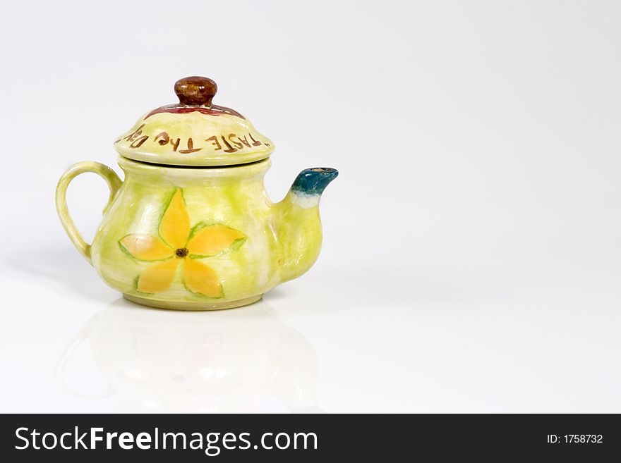 Green fancy kettle over white background