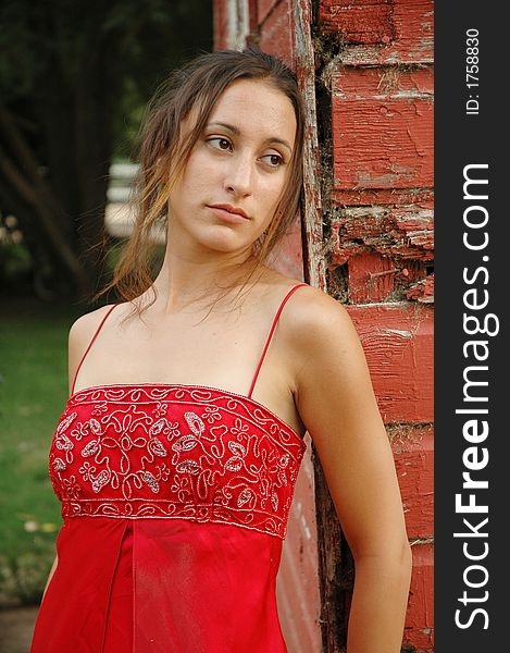 Fashion shot of a beautiful girl in red dress