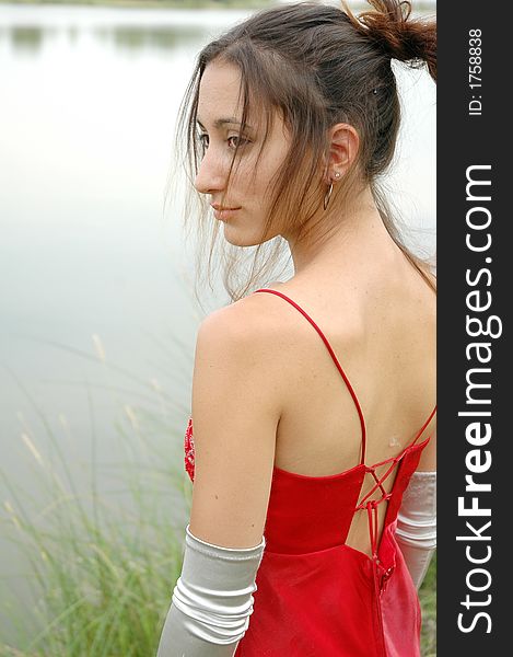 Fashion shot of a beautiful girl in red dress