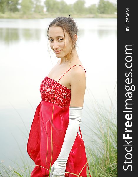 Fashion shot of a beautiful girl in red dress