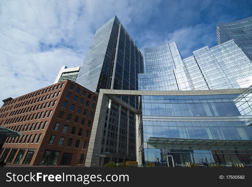 A shot of glass buildings at daytime. A shot of glass buildings at daytime