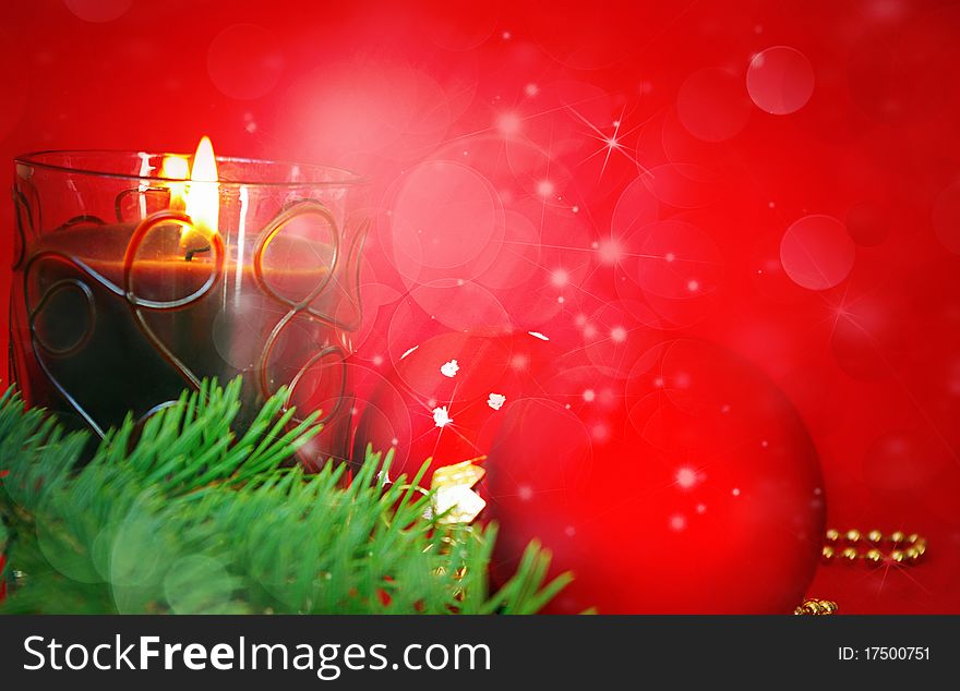 Christmas card. Candle and decoration isolated on red. Christmas card. Candle and decoration isolated on red