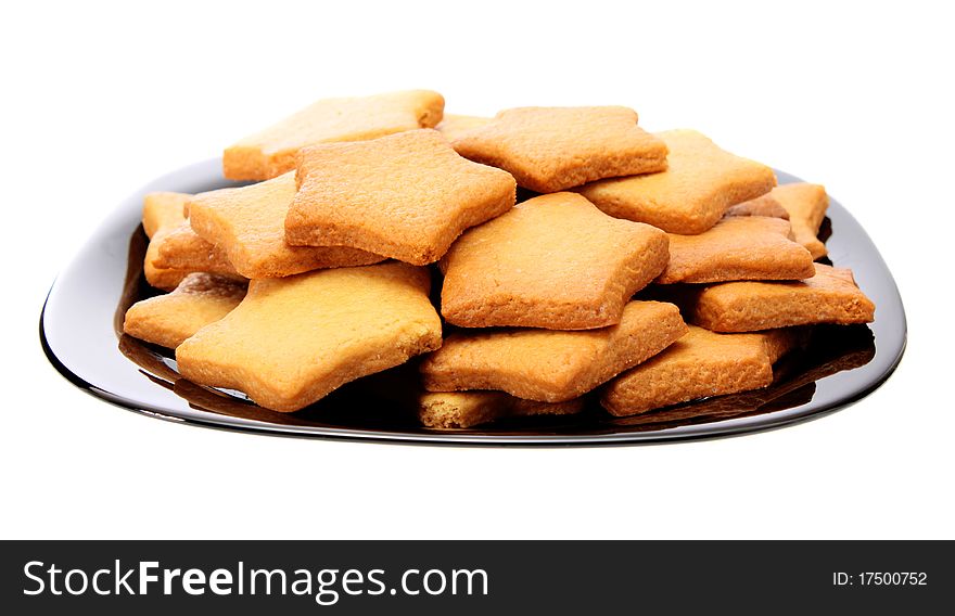 Asterisk cookies on a plate, on a white background it is isolated. Asterisk cookies on a plate, on a white background it is isolated.
