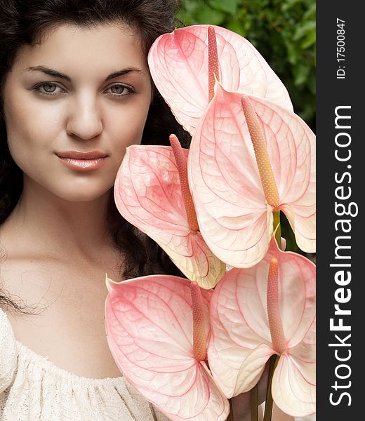 Closeup shot of pretty girl with pink flowers. Closeup shot of pretty girl with pink flowers