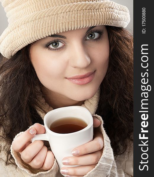 Pretty girl with cup of tea