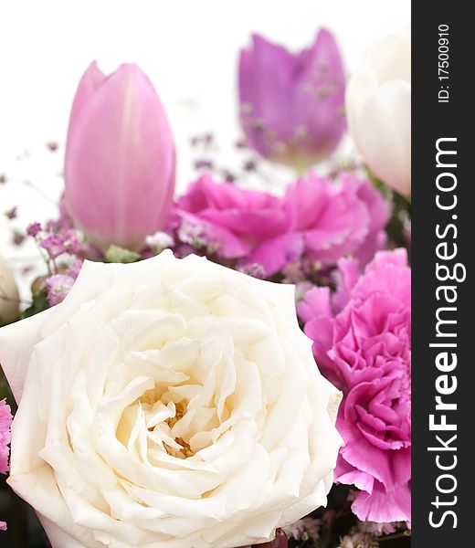 Closeup shot of colorful tulip and rose bouquet