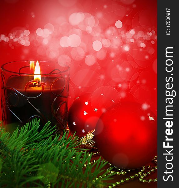 Christmas card. Candle and decoration isolated on red. Christmas card. Candle and decoration isolated on red