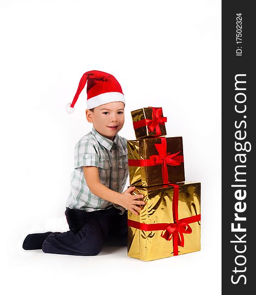 Boy In Santa Hat With A Bunch Of Gifts