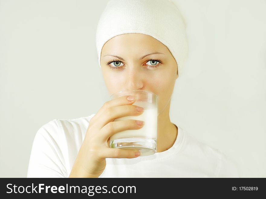 Beautiful woman drinking milk