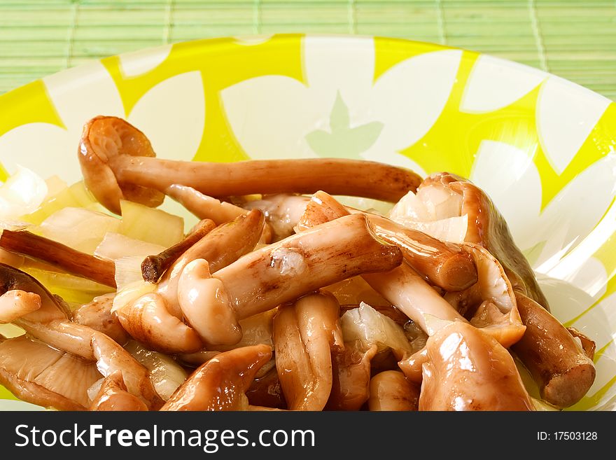 Marinated mushrooms and onions in a bowl. Marinated mushrooms and onions in a bowl