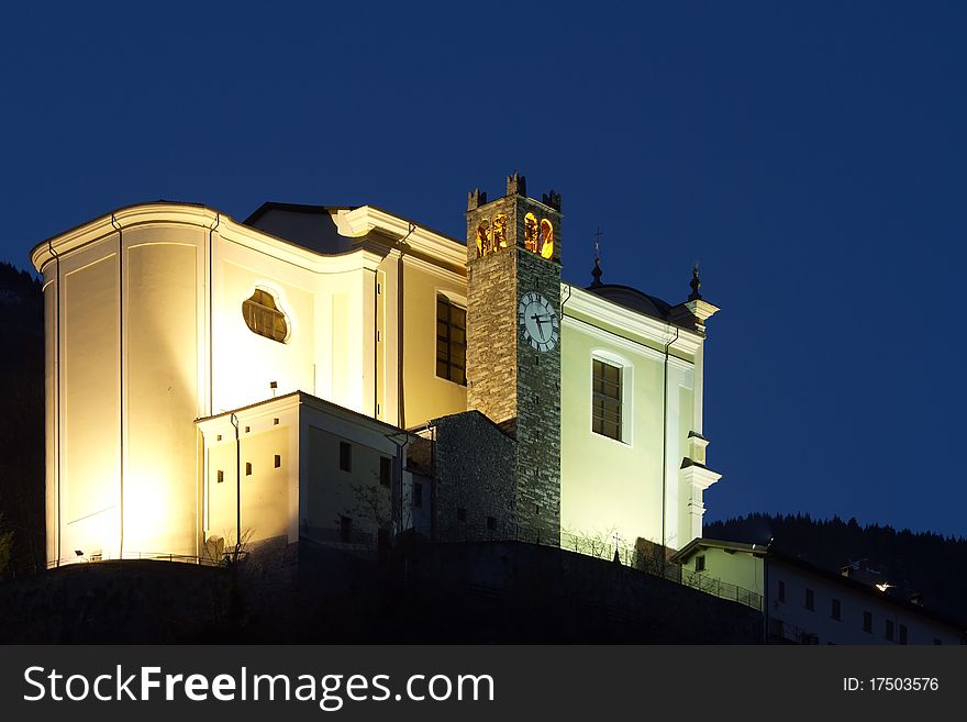 San Faustino Church during the first part of the night. Malonno village, Brixia province, Lombardy region, Italy. San Faustino Church during the first part of the night. Malonno village, Brixia province, Lombardy region, Italy