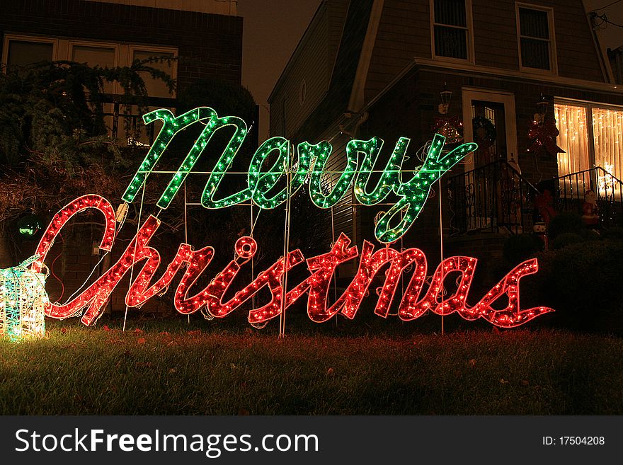 The house decoration with christmas light and sign merry christmas. The house decoration with christmas light and sign merry christmas