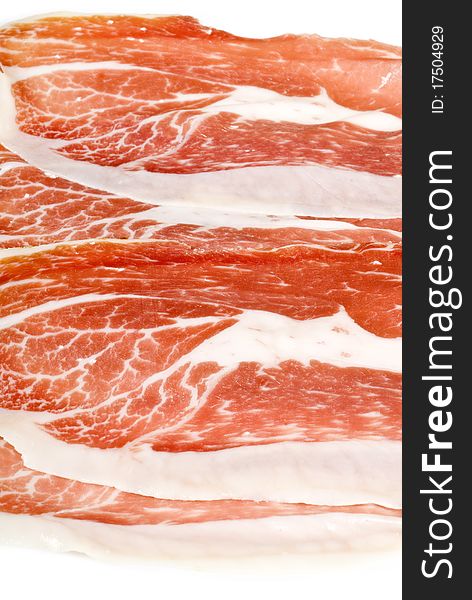 Slices of Iberico Ham isolated on white. Slices of Iberico Ham isolated on white.