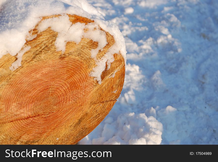 A Piece Of Wood With Snow