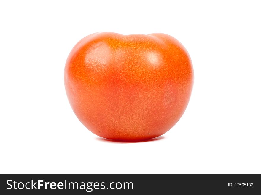 Tomato on a white background. Closeup.