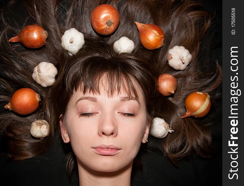 Portrait of a girl with vegetables in her hair