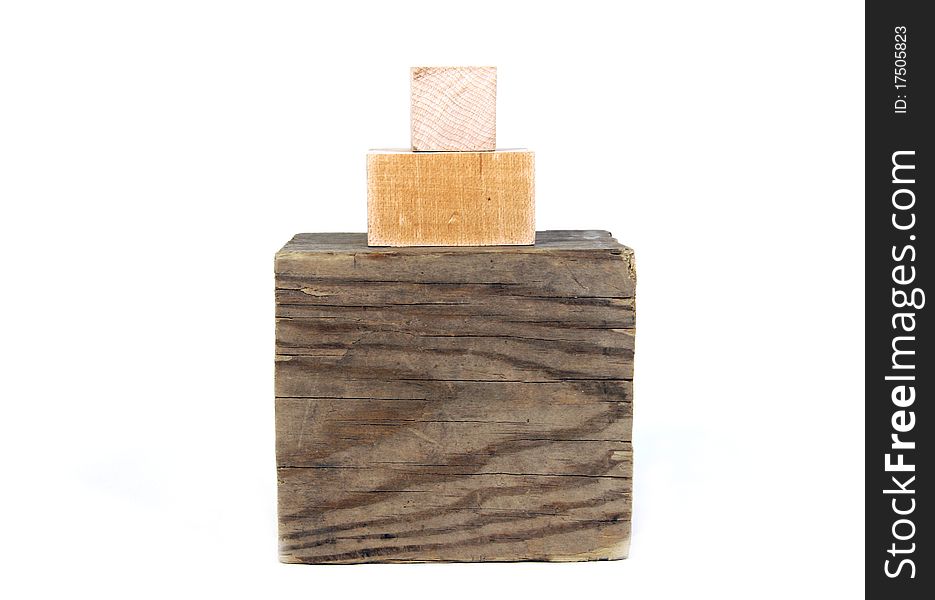 Stack of different sizes of wood blocks on white background. Stack of different sizes of wood blocks on white background