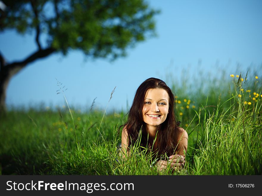 Brunette under tree