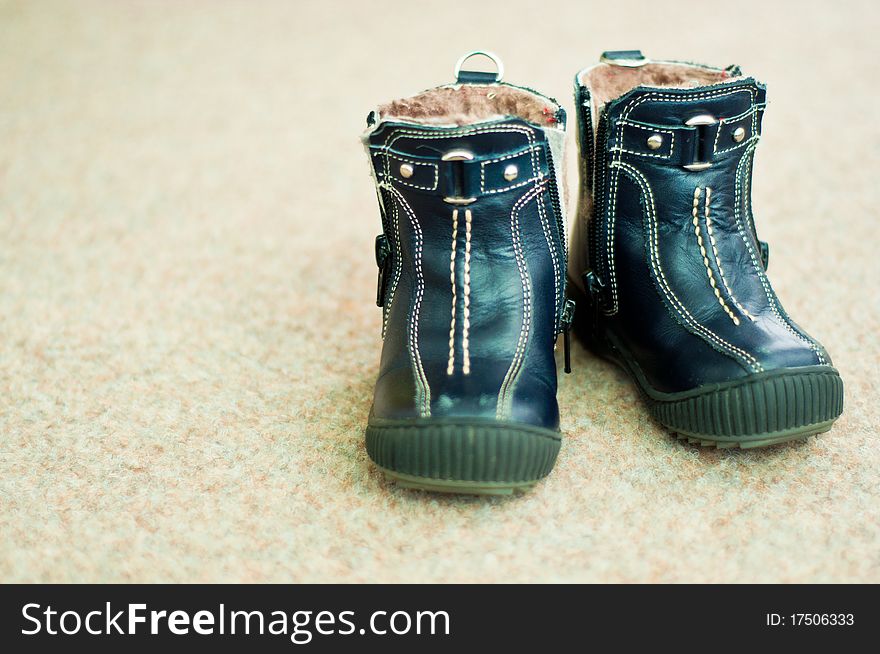 Pair of blue leather winter boots for children. Pair of blue leather winter boots for children