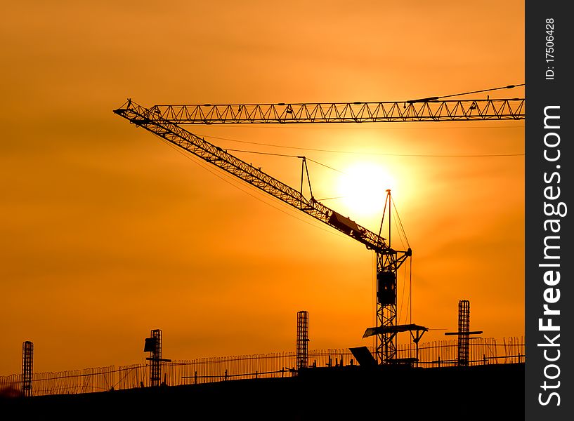 Crane for construction and beautiful sunset. Crane for construction and beautiful sunset