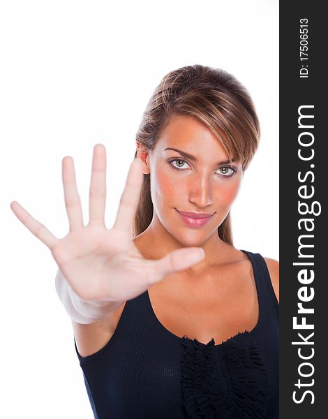 An attractive woman holding upp her hand. An attractive woman holding upp her hand