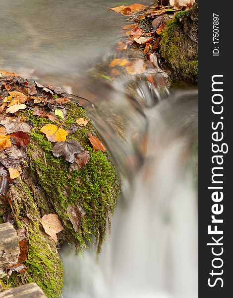 Beautiful cascade waterfall in autumn forest