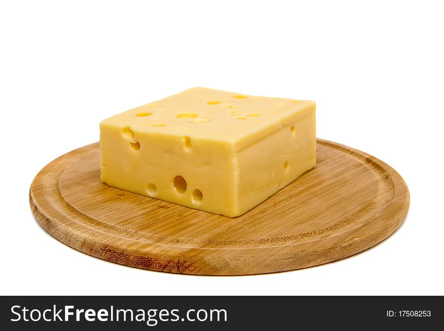 Block of cheese on cutting board, isolated on white background. Block of cheese on cutting board, isolated on white background