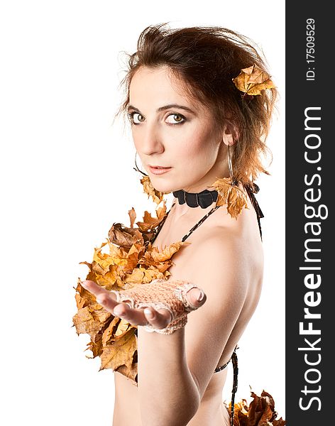 Portrait of beautiful, young sexy girl in lingerie made of leaves. White background. Studio shot. Portrait of beautiful, young sexy girl in lingerie made of leaves. White background. Studio shot.