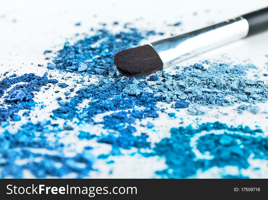 Makeup brush and cosmetics, blue