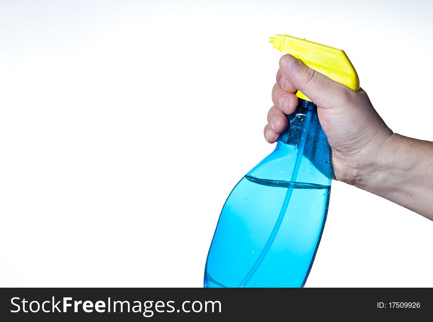 Hahd holding bottle of cleaning solution on the white background