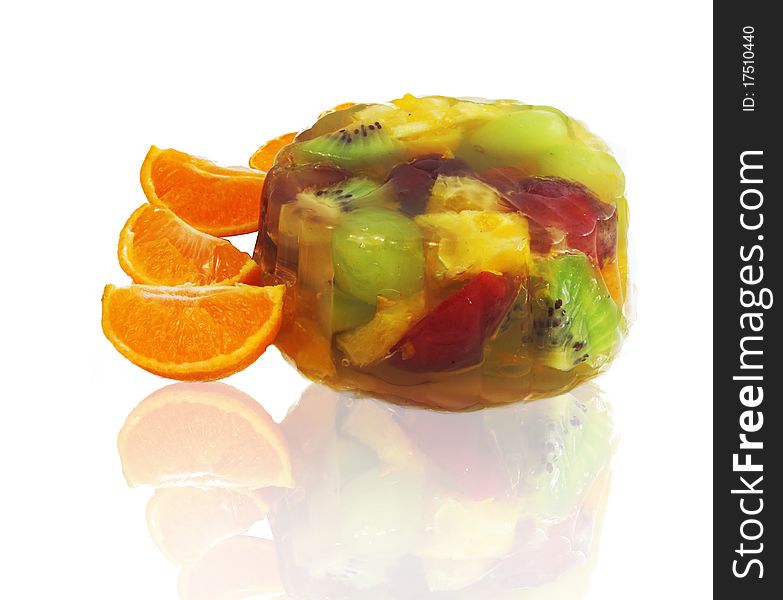Fruit salad with oranges isolated on white background.