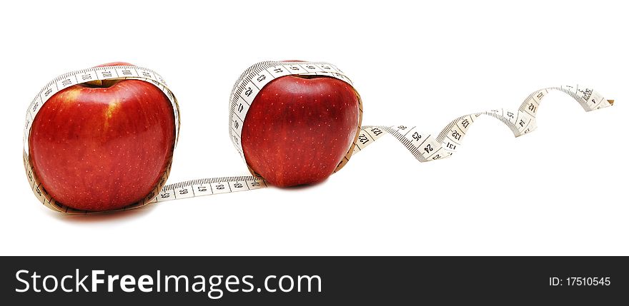 Red apple and tape measure on white. Red apple and tape measure on white