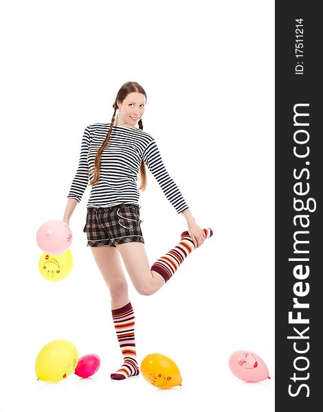 A pretty girl dressed in casual clothes playing with baloons. A pretty girl dressed in casual clothes playing with baloons