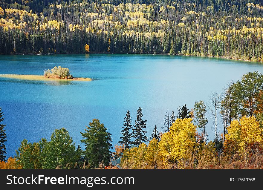 Lake surrounded by colorful forest in autumn. Lake surrounded by colorful forest in autumn