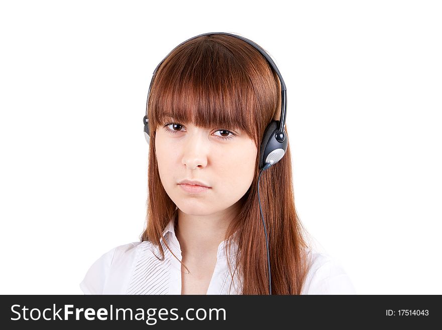 The beautiful girl listens to music in ear-phones. The beautiful girl listens to music in ear-phones