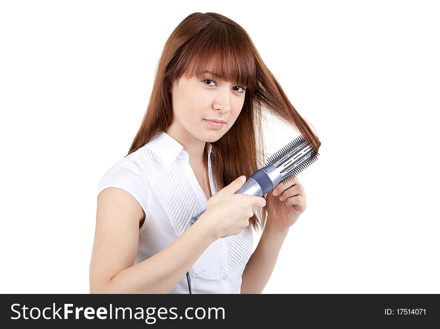 The beautiful girl dries hair the hair dryer. The beautiful girl dries hair the hair dryer