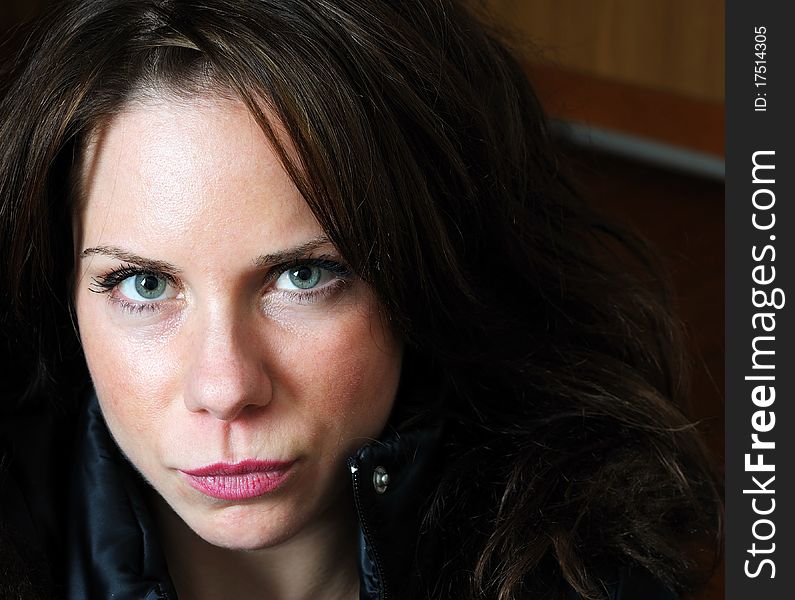 Close up image of young beautiful caucasian female with black jacket. Close up image of young beautiful caucasian female with black jacket