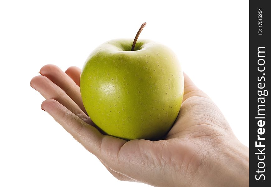 The hand holding an apple, it is isolated on the white. The hand holding an apple, it is isolated on the white