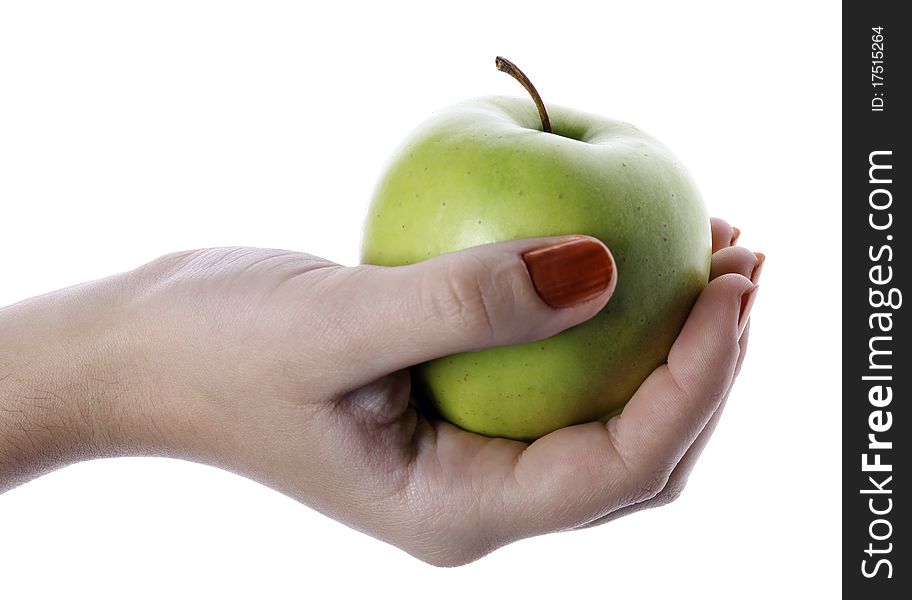 The hand holding an apple, it is isolated on the white. The hand holding an apple, it is isolated on the white