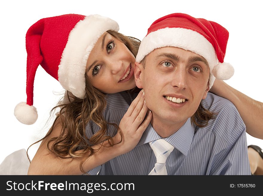 Young woman whispering in boyfriend`s ear. Isolated over white background