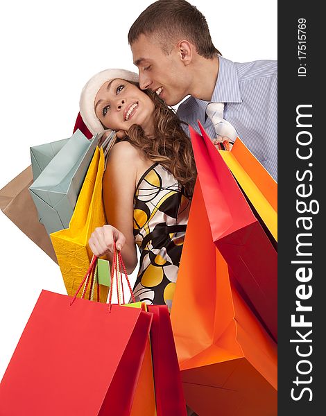 Lovely couple making christmas shopping. Isolated on white.