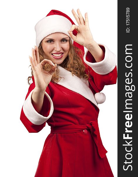 Happy girl in Santa Claus hats showing okay sign. Happy girl in Santa Claus hats showing okay sign